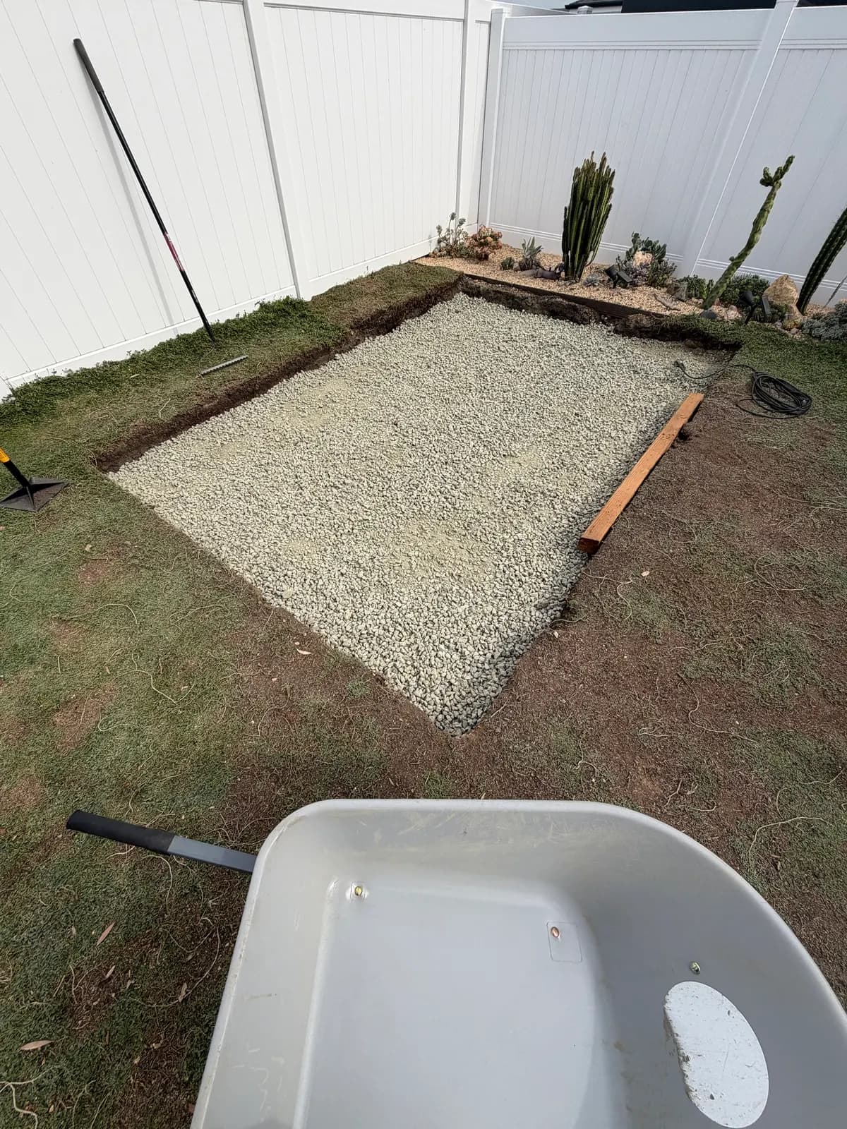 Gravel covering the whole pad, with a timber laid alongside