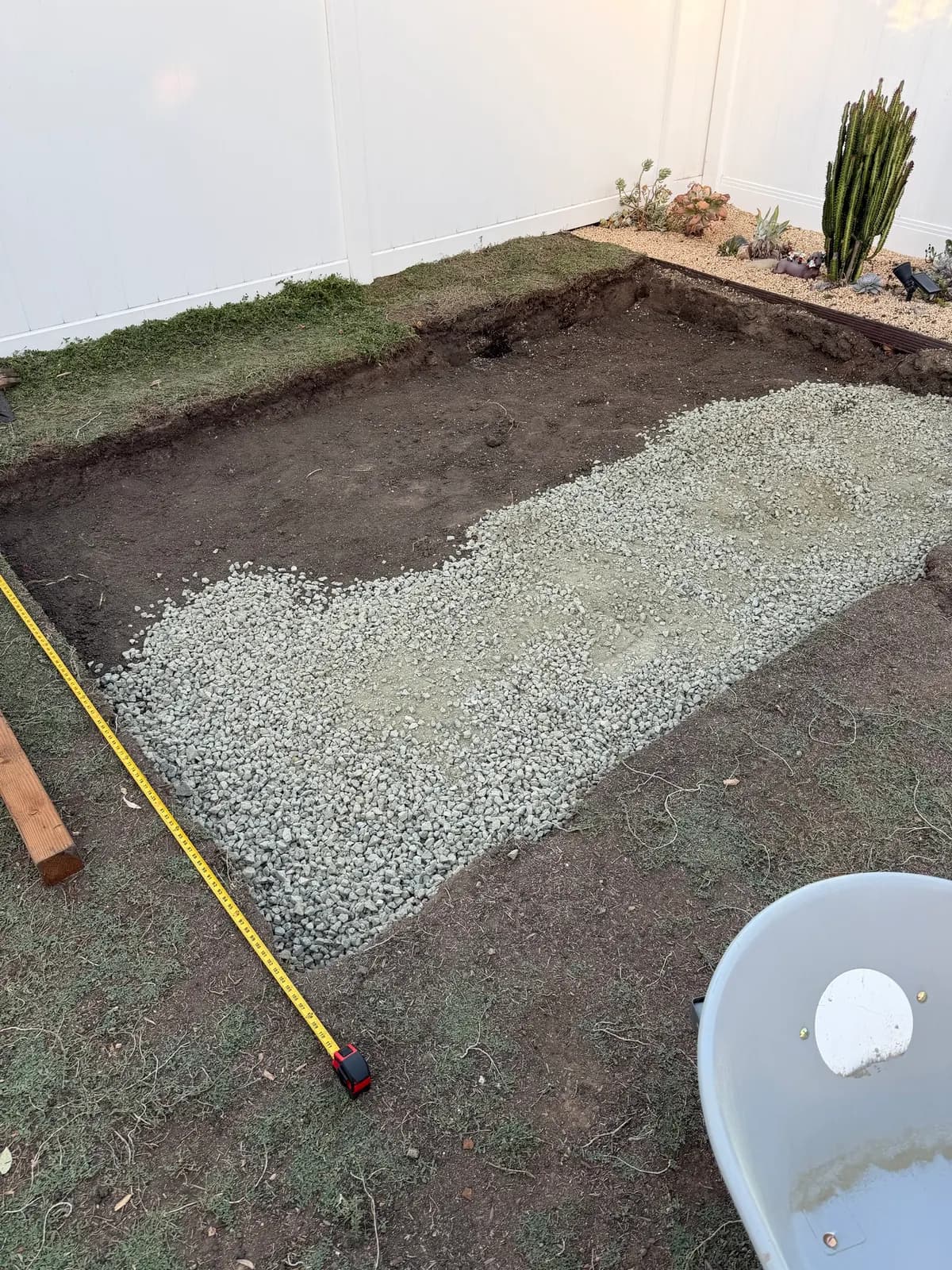 Gravel half spread across the excavated pad
